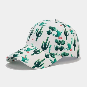 Close-up of tropical green cactus pattern with pink flowers on white cotton baseball cap