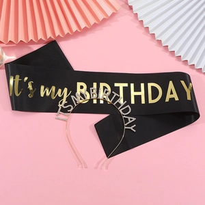 Detail of black satin sash with gold foil and silver rhinestone birthday headband