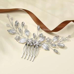 Silver leaf hair comb with white pearls and sparkling rhinestones for bridal hairstyles