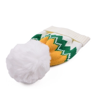 Close-up of knit beanie showing green and orange zigzag patterns and white faux fur pompom