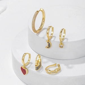 Gold-plated earring set with micro-pave zircon charms including heart and moon patterns