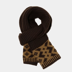 Detail of chunky knit scarf in dark brown with stylish leopard jacquard patterns