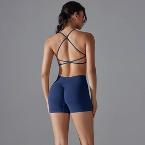 Detail of cross-back yoga bra and scrunch butt gym shorts in navy blue knit fabric