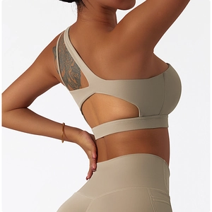 Detail of nude-feel sports bra with asymmetrical strap and back cutout design