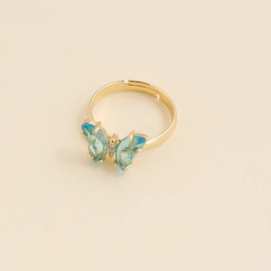 Bague papillon ajustable dorée avec cristaux bleu clair et accents de zircone blanche