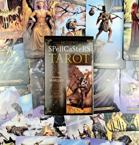 Top view of Modern SpellCaster's Tarot cards with colorful illustrations and original box
