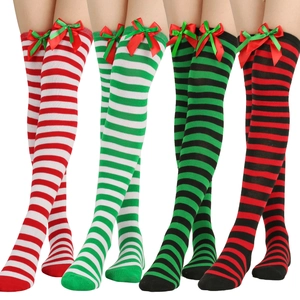 Detailed view of over-knee Christmas stockings with striped patterns and festive bows