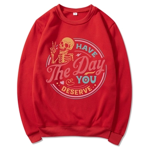 Red crewneck sweatshirt with retro HAVE THE DAY YOU DESERVE skull graphic