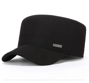 Close-up of black cadet cap featuring twill texture and decorative metal side logo