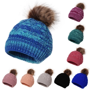 Winter cable knit baby hat with large faux fur pompom in multiple solid colors
