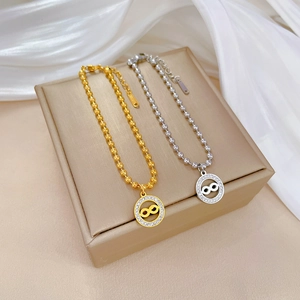 Infinity charm beaded bracelet in gold and silver steel finishes with crystal accents