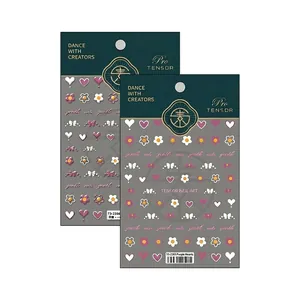 3D embossed nail art stickers featuring purple heart and bow designs on dual sheets