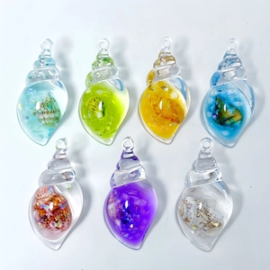 Detailed view of colorful luminous conch resin pendants with glitter and hanging loops