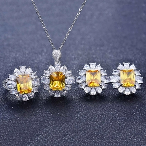 Luxury jewelry set with yellow square stones and clear zircon in a floral silver setting