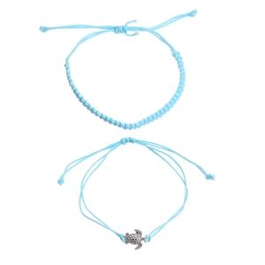 Detail of blue braided turtle anklets with adjustable cords and silver sea turtle charms