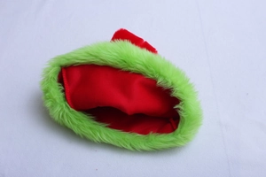 Close-up of red felt Christmas hat with fluffy neon green faux fur trim detail