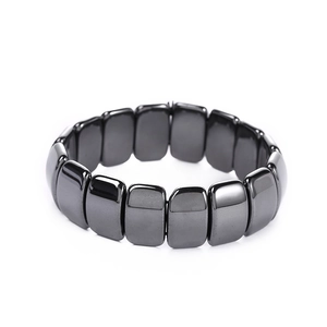 Close-up of wide magnetic black hematite bracelet with rectangular metallic links