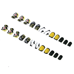 Short zebra pattern press-on nails set with yellow, black and white abstract fluid art