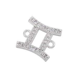 Detailed close-up of silver Gemini zodiac connector with micro-pave white cubic zirconia
