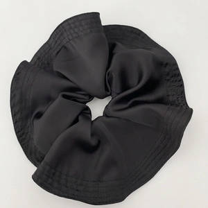 Elegant oversized black satin scrunchie with pleated texture for women hair styling