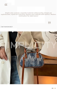 Detail of blue denim sequins handbag with brown leather straps held by a model