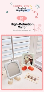 Detail of cartoon vanity mirror with cute eye decor and stable foot-shaped base