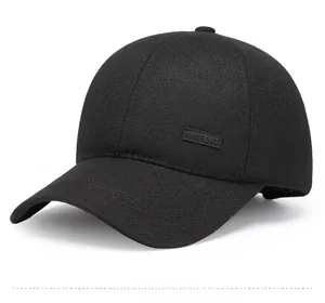 Detail of black baseball cap showing twill fabric texture and SPORT patch side view