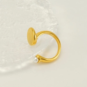 Minimalist gold plated adjustable open ring featuring a white pearl and flat disc design