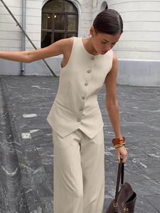 Elegant beige two-piece suit set featuring a tailored vest and wide-leg trousers for women