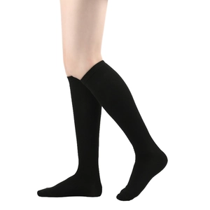 Side view of black knee-high college style socks on model legs