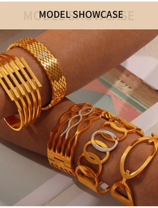 Detail shot of multi-layered hollow gold bracelets with sparkling crystal accents