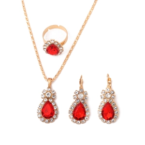 Elegant gold-tone teardrop jewelry set with red gemstones and crystals on white background