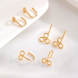 Bagues d'oreilles géométriques dorées avec forme en U et symbole de l'infini élégant