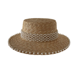 Elegant wheat straw flat top boater hat featuring luxury layered pearl band decor