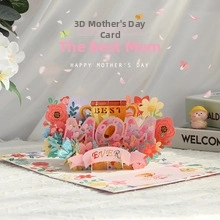 Detailed 3D pop-up card featuring pink paper flowers and a Best Mom Ever trophy design