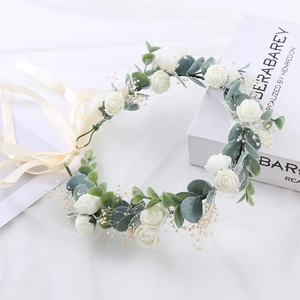 Floral bridal crown with white roses, eucalyptus leaves and adjustable beige ribbon