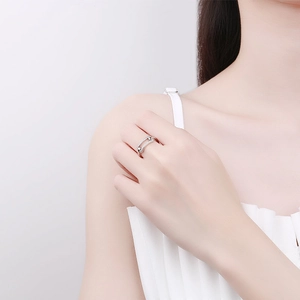 Silver double layer ring with small zircon stones worn by a model on finger