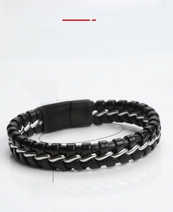 Detail view of a 21.5cm black braided leather bracelet with stainless steel accents