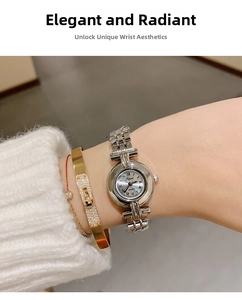 Elegant ladies silver steel watch with Roman numerals styled with gold bracelets