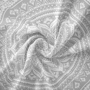 Close-up of mandala tapestry fabric showing bohemian pattern and soft textile texture