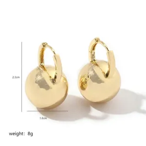Elegant gold metal ball drop earrings with high-polish finish on a minimalist hoop design