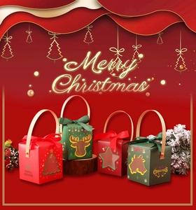 Detail of Christmas gift boxes with transparent windows and festive ribbons in red and green