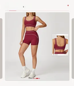 Detail of burgundy two-piece yoga set featuring white contrast stitching and U-neck sports bra