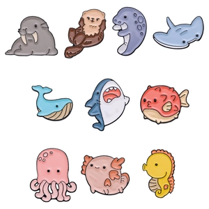 Set of 10 colorful marine life enamel pins including shark and jellyfish designs