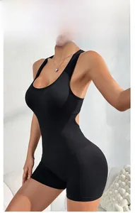 Detail of black seamless ribbed yoga bodysuit with backless design and U-neck silhouette