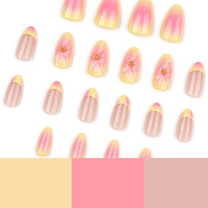 3D floral press-on nails with yellow and pink blush gradient in a French manicure style