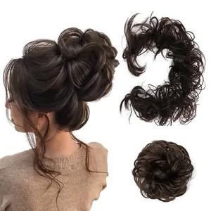 Detail view of dark brown curly hair bun extension with natural voluminous texture