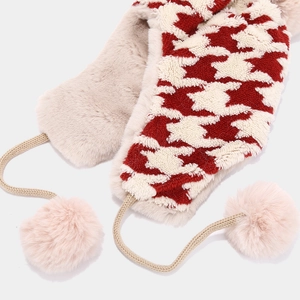 Women's houndstooth trapper hat with red and white knit pattern and plush earflaps