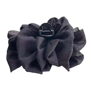 Large black textured bubble claw clip with a fluffy cloud-like bow design on a white background