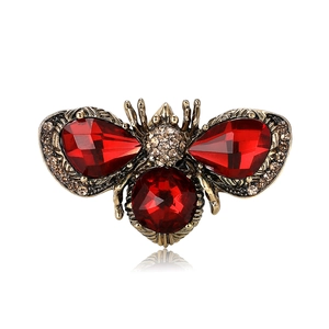 Vintage bumblebee brooch with red pear-cut crystals and gold-tone metal plating